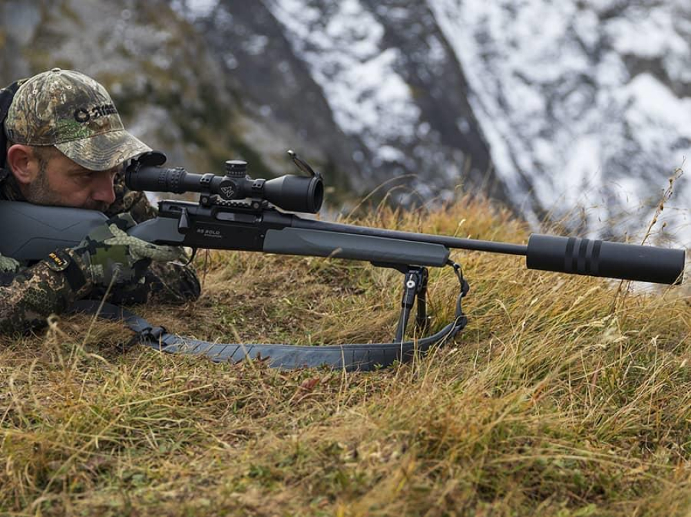 a hunter takes aim with the Strasser AVA-Tahr